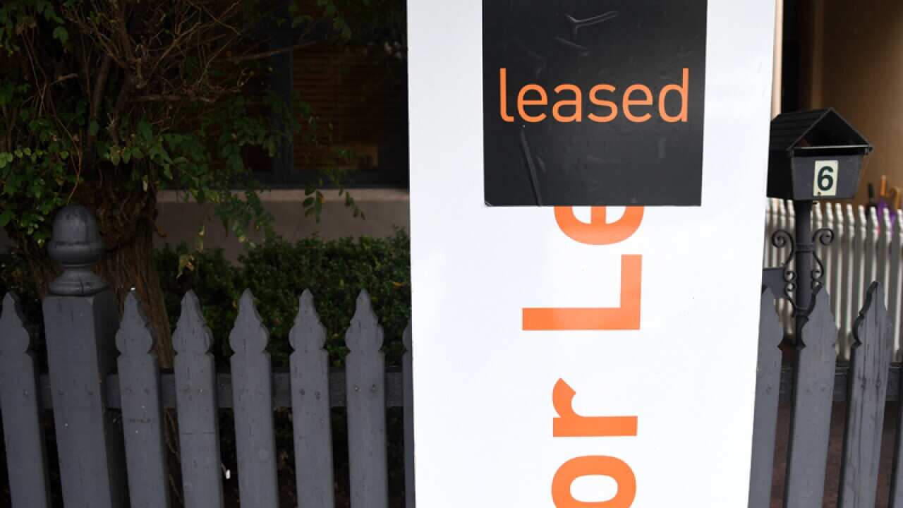 A for lease sign is displayed in front of a house