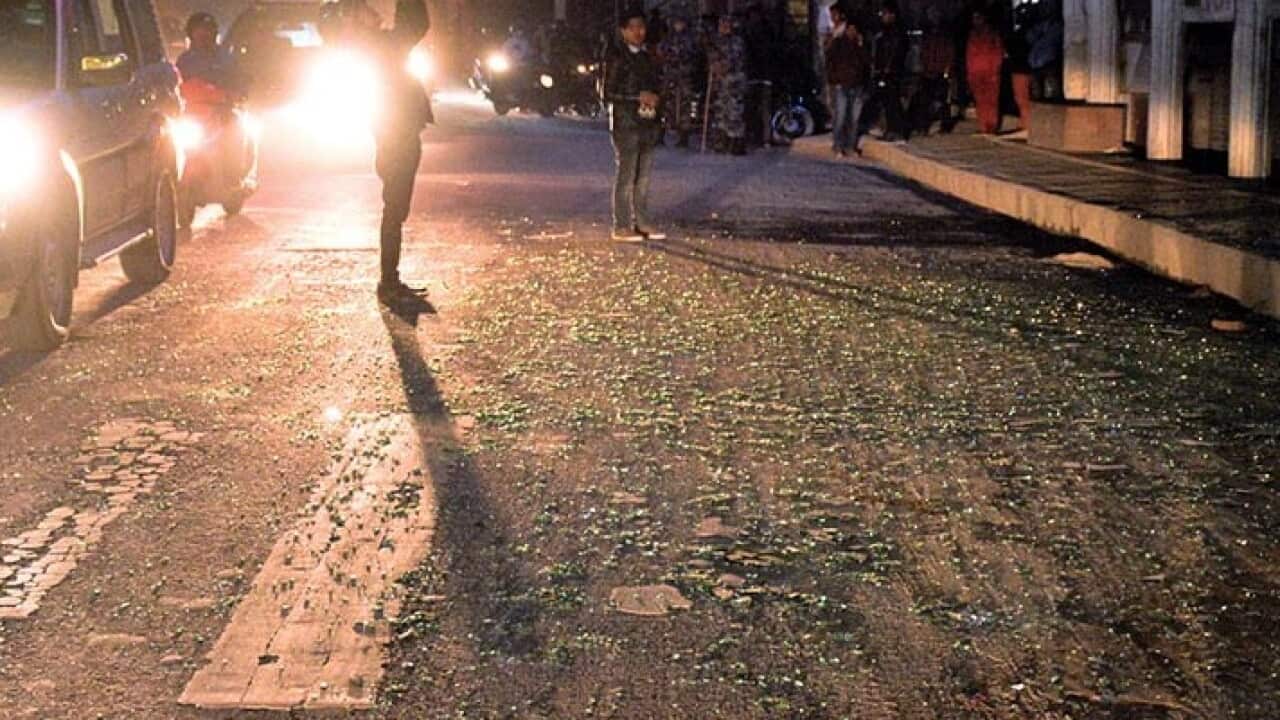 This image shows shards of glass shattered from roadside showrooms littering on street outside Ncell office in Nakkhu, Lalitpur, on Friday, February 22, 2019. The blast outside Ncell office left three people injured. Photo: Naresh Shrestha/THT