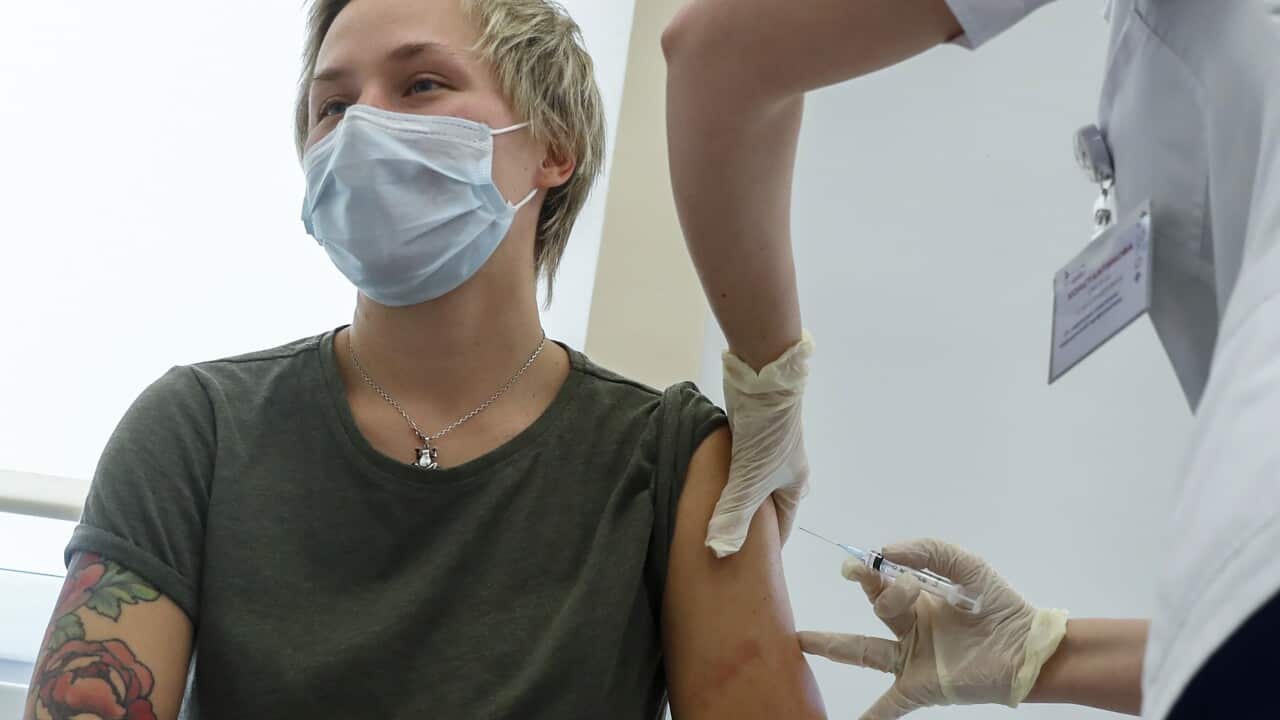 A Russian medical worker administers a shot of Russia's Sputnik V coronavirus vaccine in Moscow on 5 December, 2020.
