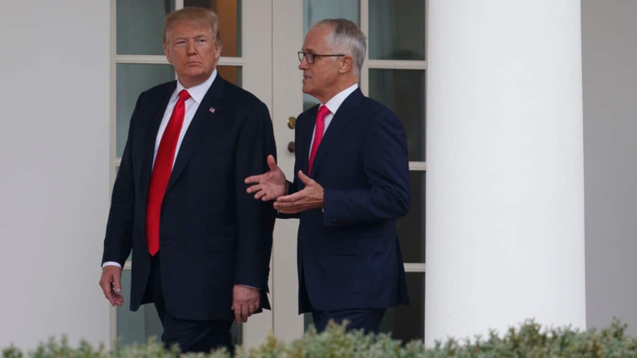 President Donald Trump and Australian Prime Minister Malcolm Turnbull walk along the colonnade to the Oval Office of the White House in Washington, Friday, Feb. 23, 2018. (AP Photo/Carolyn Kaster)
