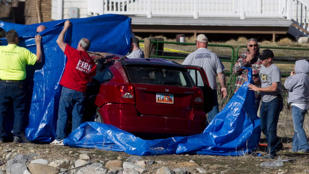 officials respond to a report of car in the Spanish Fork River
