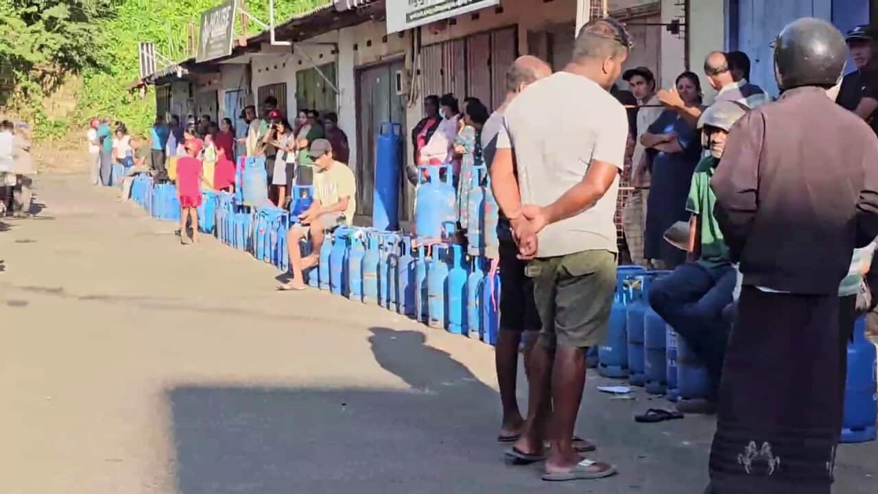 People waiting for cooking gas