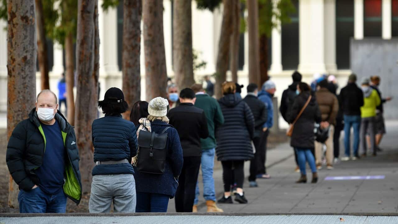 People are seen lining up outside of COVID-19 vaccination centre in Melbourne on 1 June 2021.  