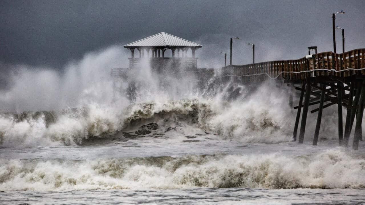 13/09/2018 10:00 Waves slam the Oceana Pier & Pier House Restaurant in Atlantic Beach, N.C., Thursday, Sept. 13, 2018 as Hurricane Florence approaches