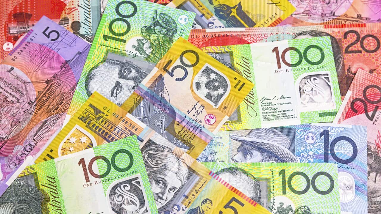 Random Australian dollar banknotes spread out
