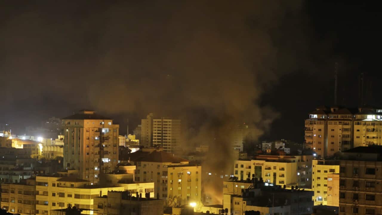 Smoke rises from a vehicle, in Gaza City