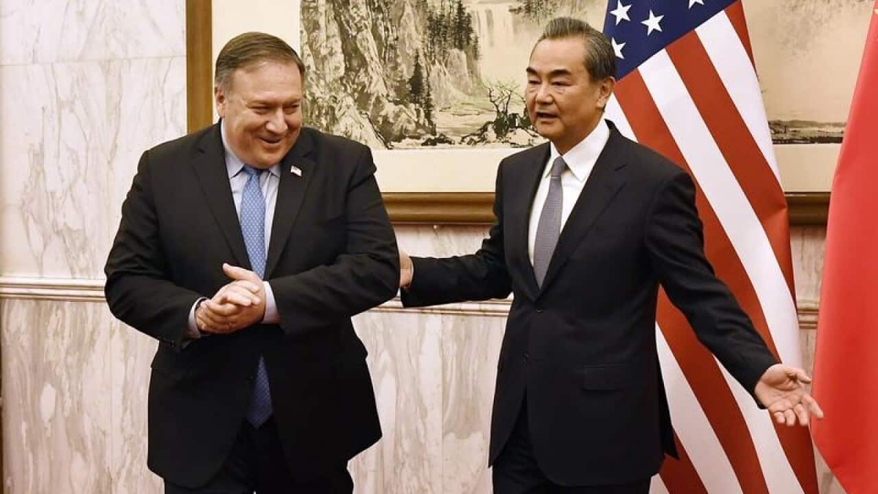 US Secretary of State Mike Pompeo, left, meets with Chinese Foreign Minister Wang Yi in Beijing.