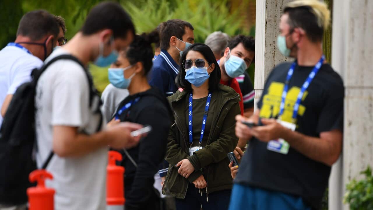 Tennis players and officials wait in line to receive covid19 tests at the View Hotel in Melbourne, Thursday, February 4, 2021. Australian Open preparations are on hold after a hotel worker's positive coronavirus case put health authorities on alert. (AAP