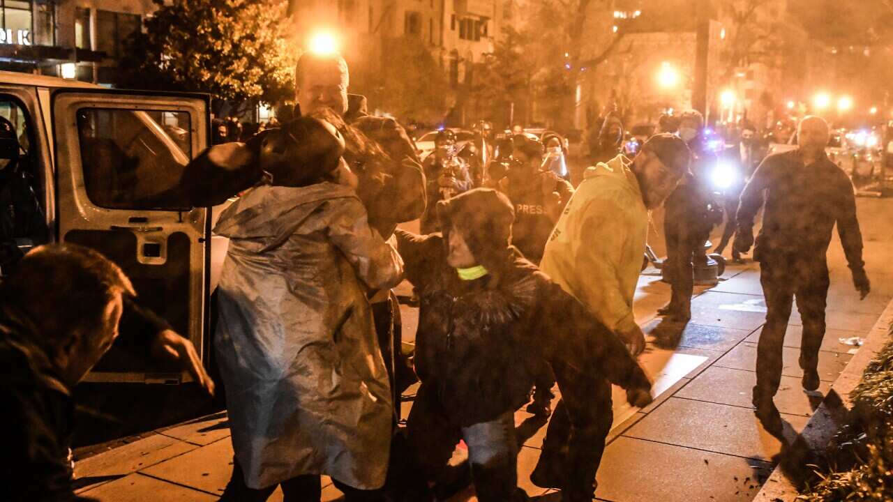 Protesters clash at a demonstration in Washington, DC, on 12 December.