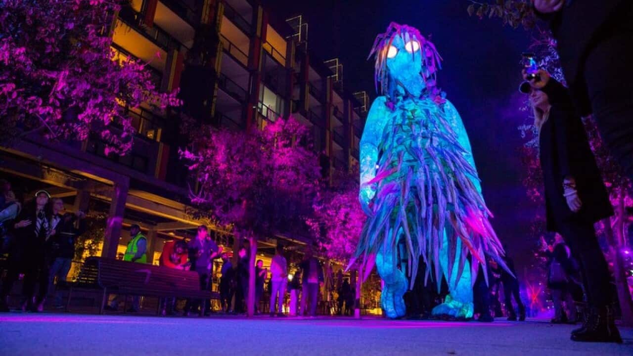 A six-metre-high luminescent puppet inspired by First Nations women walking on the harbourfront boardwalk in Barangaroo, Sydney
