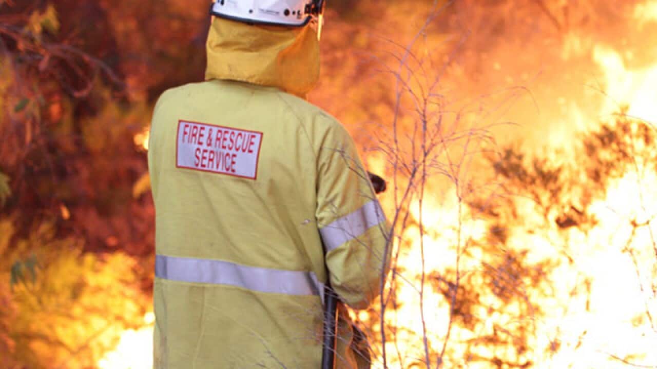 Firefighters battle an out-of-control bushfire in WA