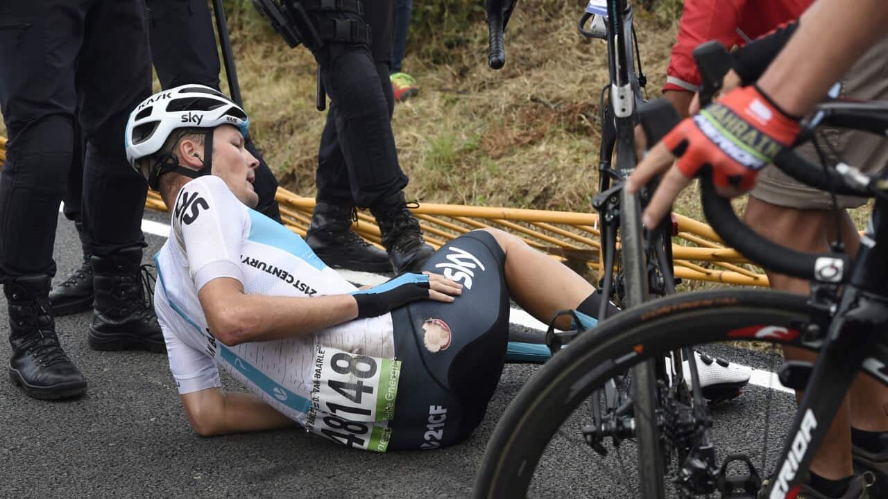 Team Sky's Dylan Van Baarle on the deck following a crash with a clueless official after crossing the finish line of Stage 12 2018 La Vuelta a Espana (Getty)