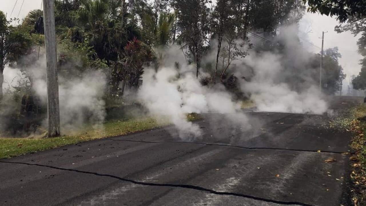 Volcanic gas rises through fissures in the residential Leilani Estates on Hawaii's Big Island.