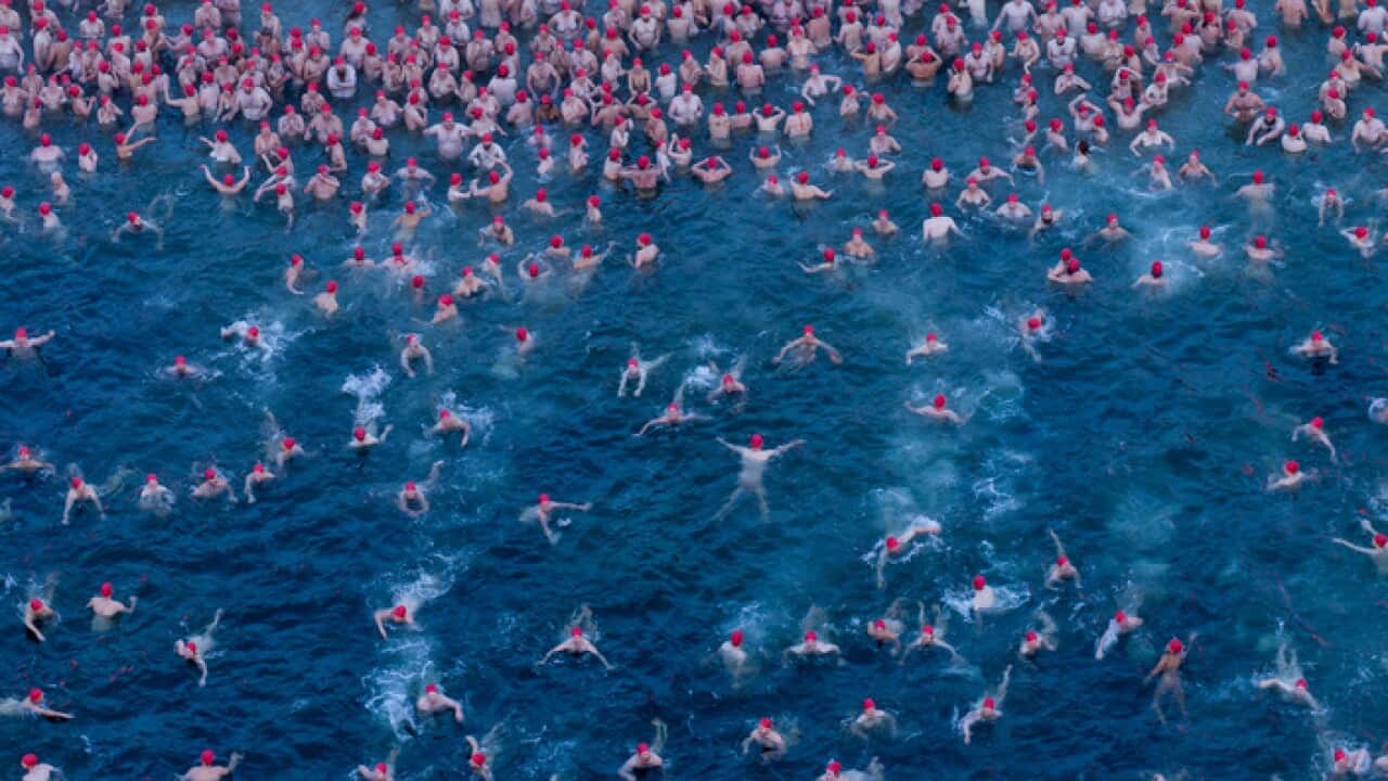 After the initial shock of the icy temperatures, swimmers started enjoying the swim.