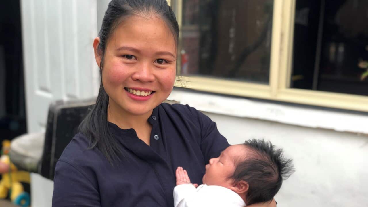 Thanh Binh and baby Joe (SBS News)