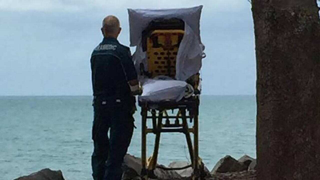 Queensland Ambulance Service shared photo of paramedics granting palliative patient a wish.