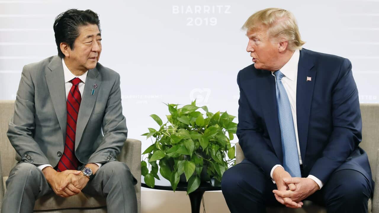 Japanese Prime Minister Shinzo Abe (L) and U.S. President Donald Trump hold their talks in Biarritz, southwestern France.