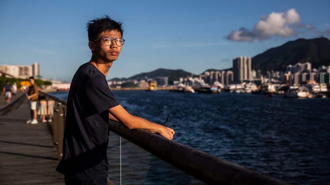 This picture taken on 8 August shows teenager Tony Chung posing near the water in Hong Kong.