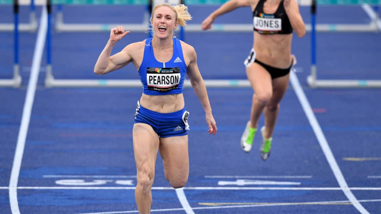 Australian athlete Sally Pearson (left) celebrates