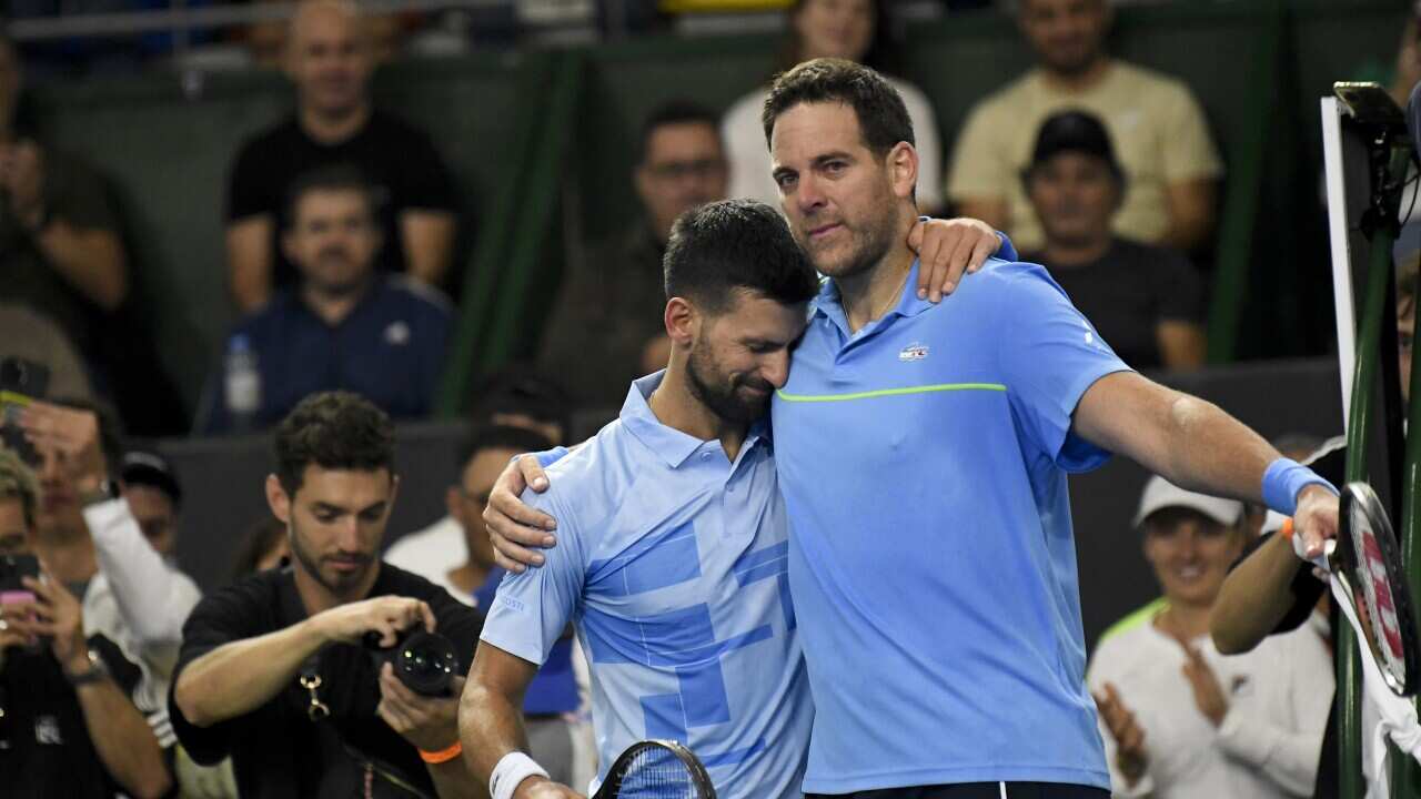Serbia's Novak Djokovic, left, embraces Argentina's Juan Martin Del Potro at the end of an exhibition tennis match in Buenos Aires, Argentina, Sunday, Dec. 1, 2024
