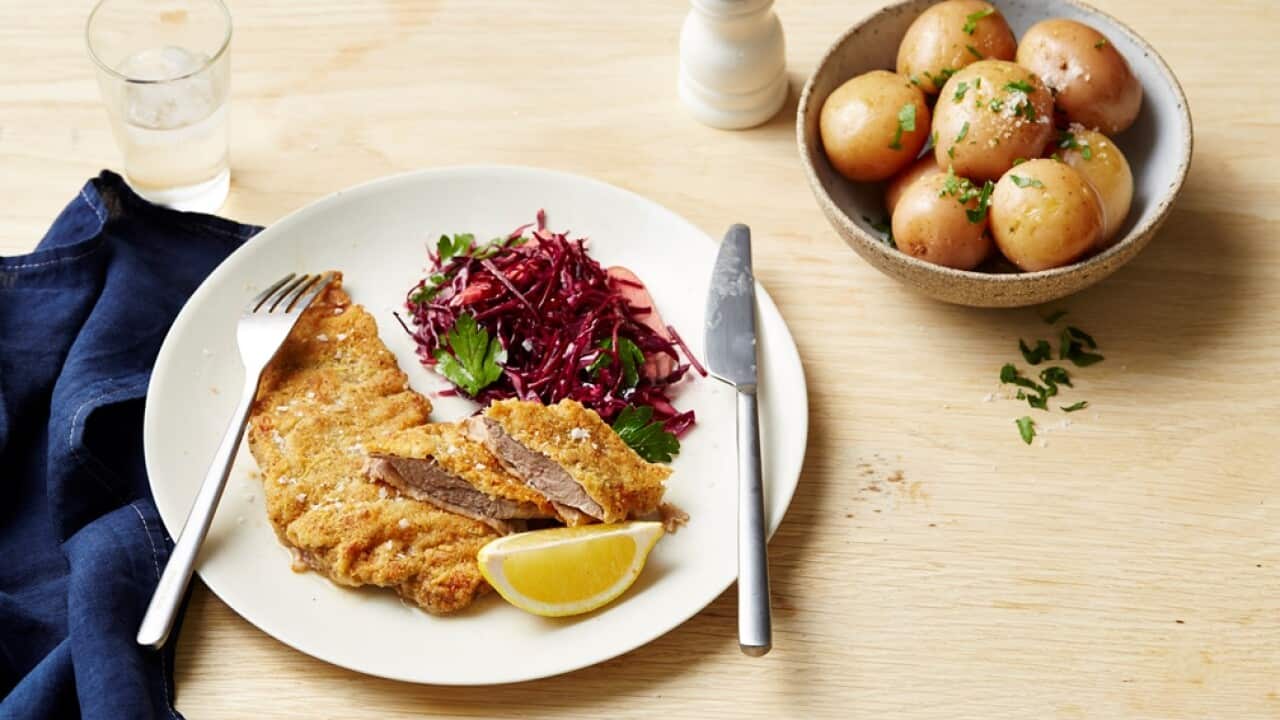Walnut and parmesan crumbed schnitzel with red coleslaw