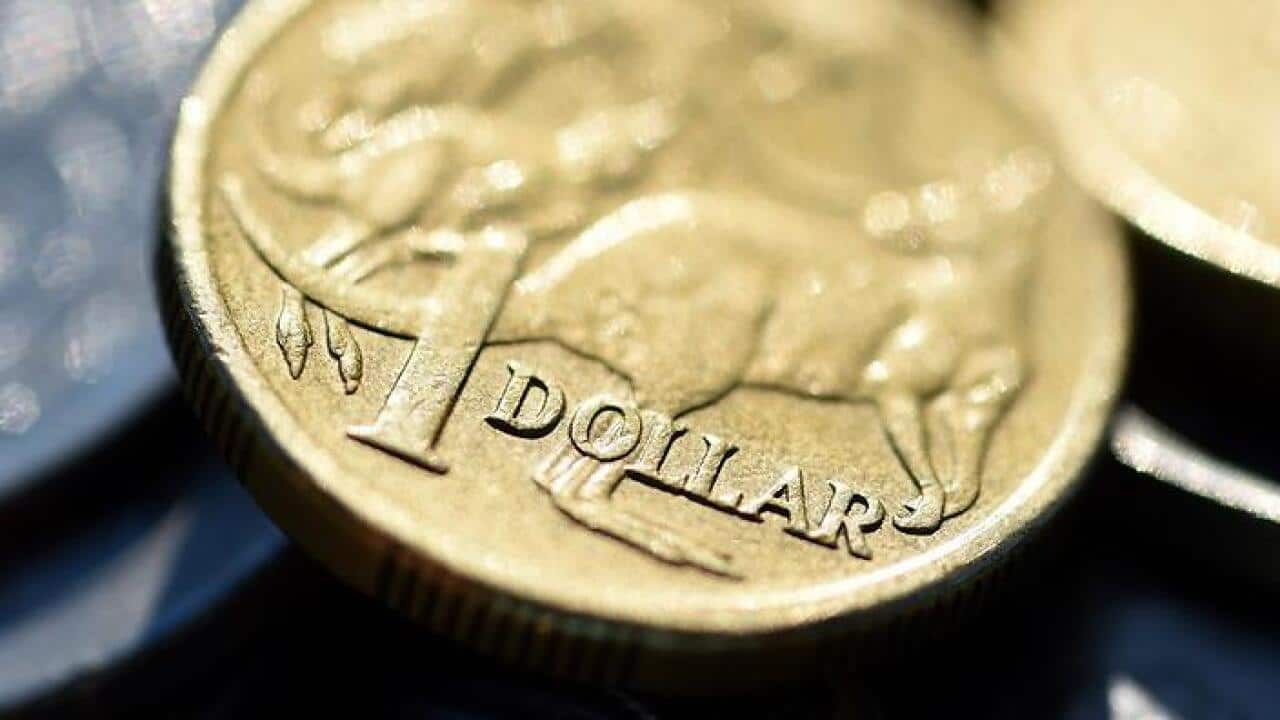 The Australian dollar is seen amongst other Australian coins, Thursday, April 23, 2015. (AAP Image/Dave Hunt) NO ARCHIVING.