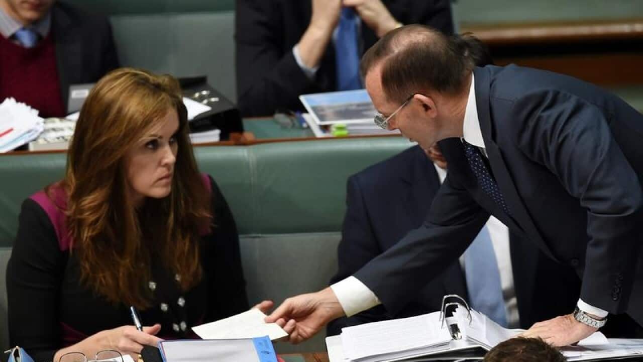 Tony Abbott speaks to chief of staff Peta Credlin in 2015.