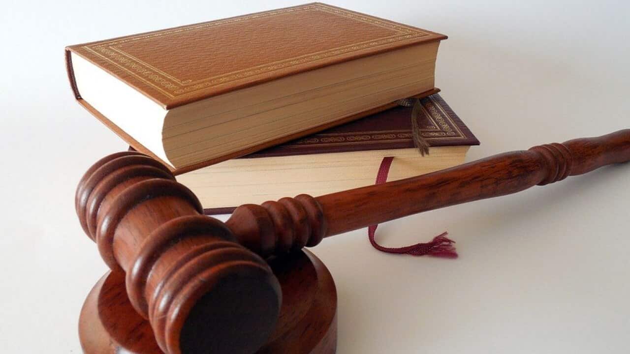 A woman has been found guilty of taking her two daughters overseas to undergo female genital mutilation.