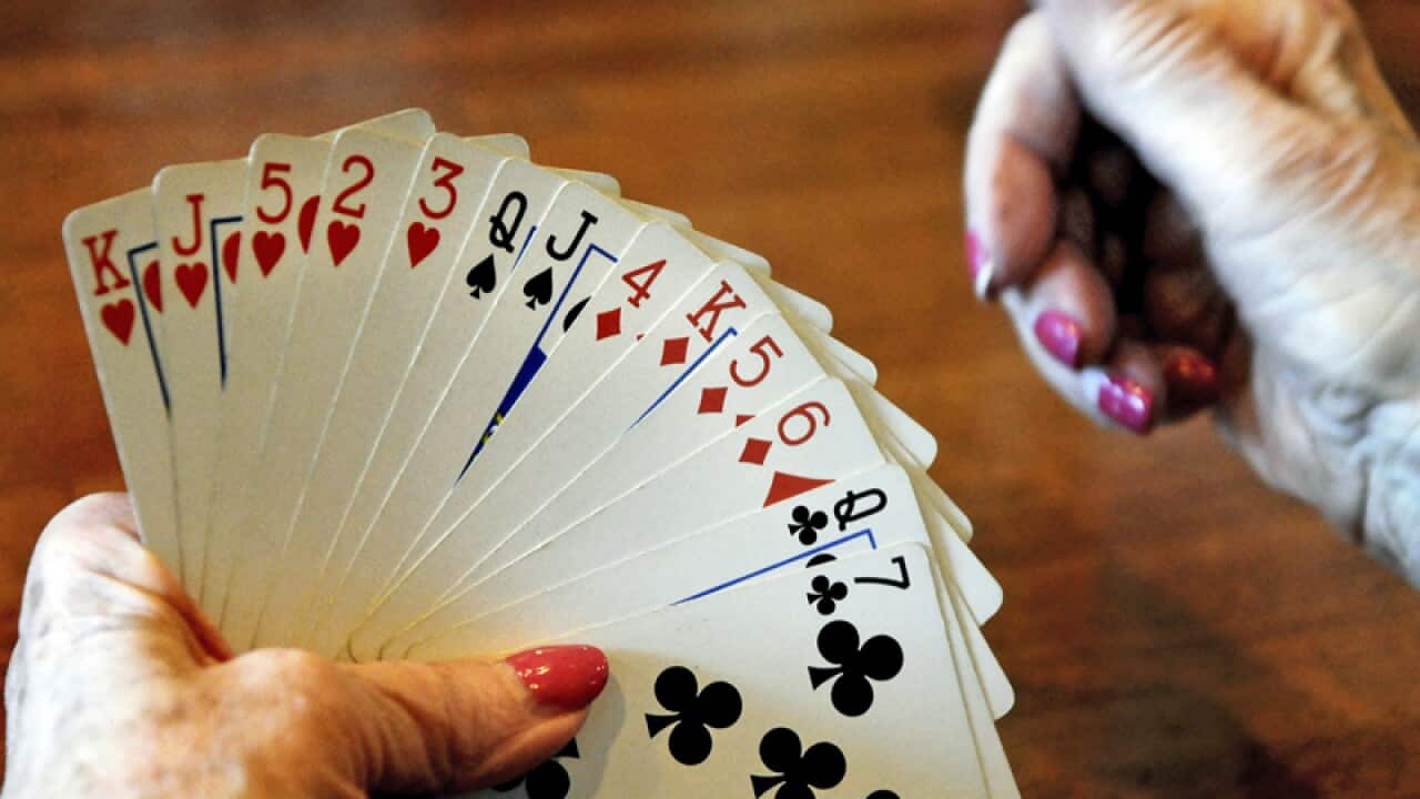 A woman plays bridge