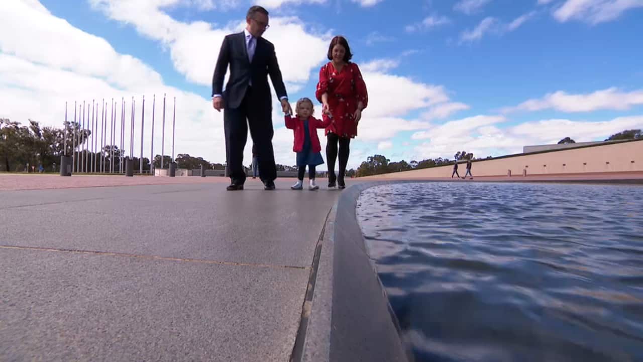 The McDonald's with their daughter Matilda in Canberra for the announcement.