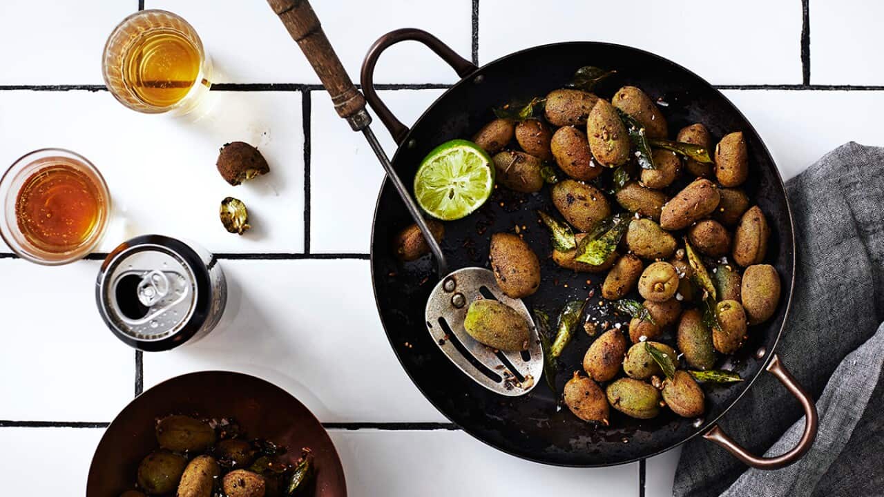 Devilled green almonds