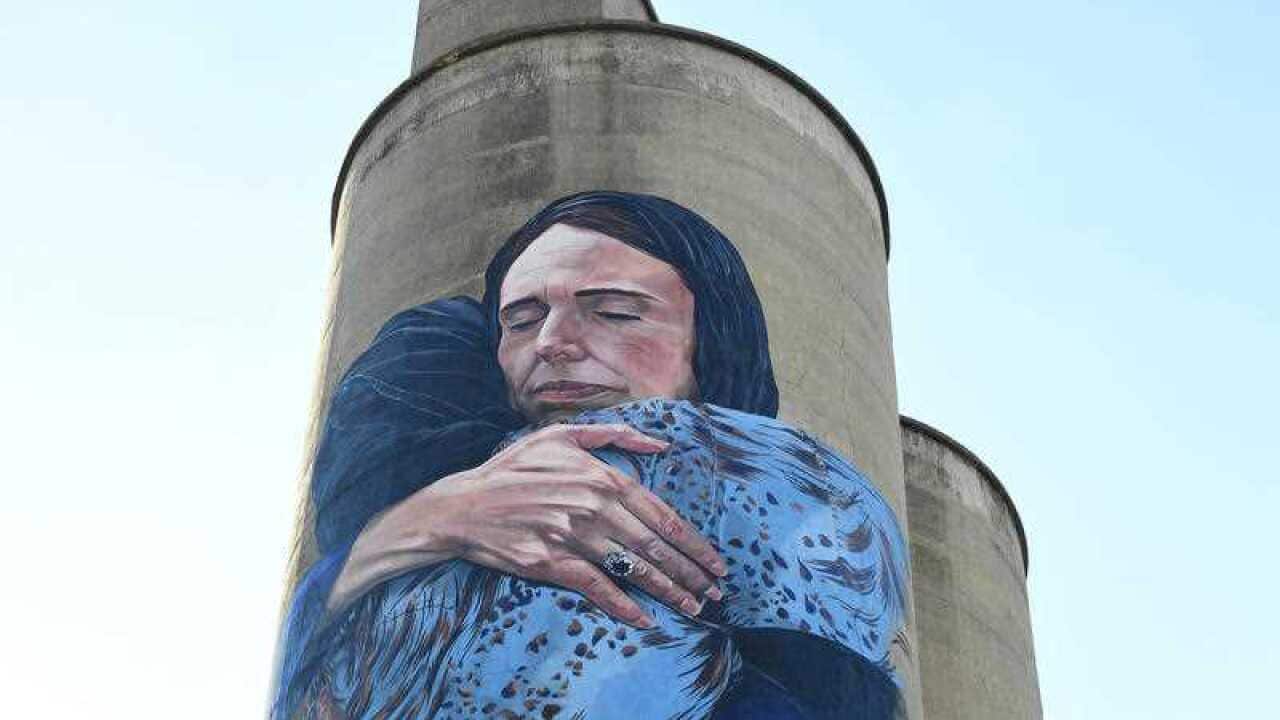 It's finished: a giant mural depicted New Zealand Prime Minister Jacinda Ardern embracing a Muslim woman has been unveiled in Melbourne.