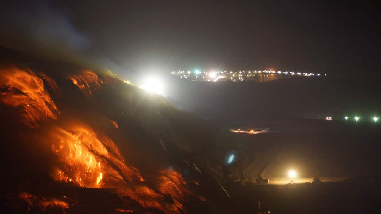In this Feb. 25, 2014, photo provided by the Incident Control Centre, a fire burns at the Hazelwood Coal Mine at Morwell, Australia.