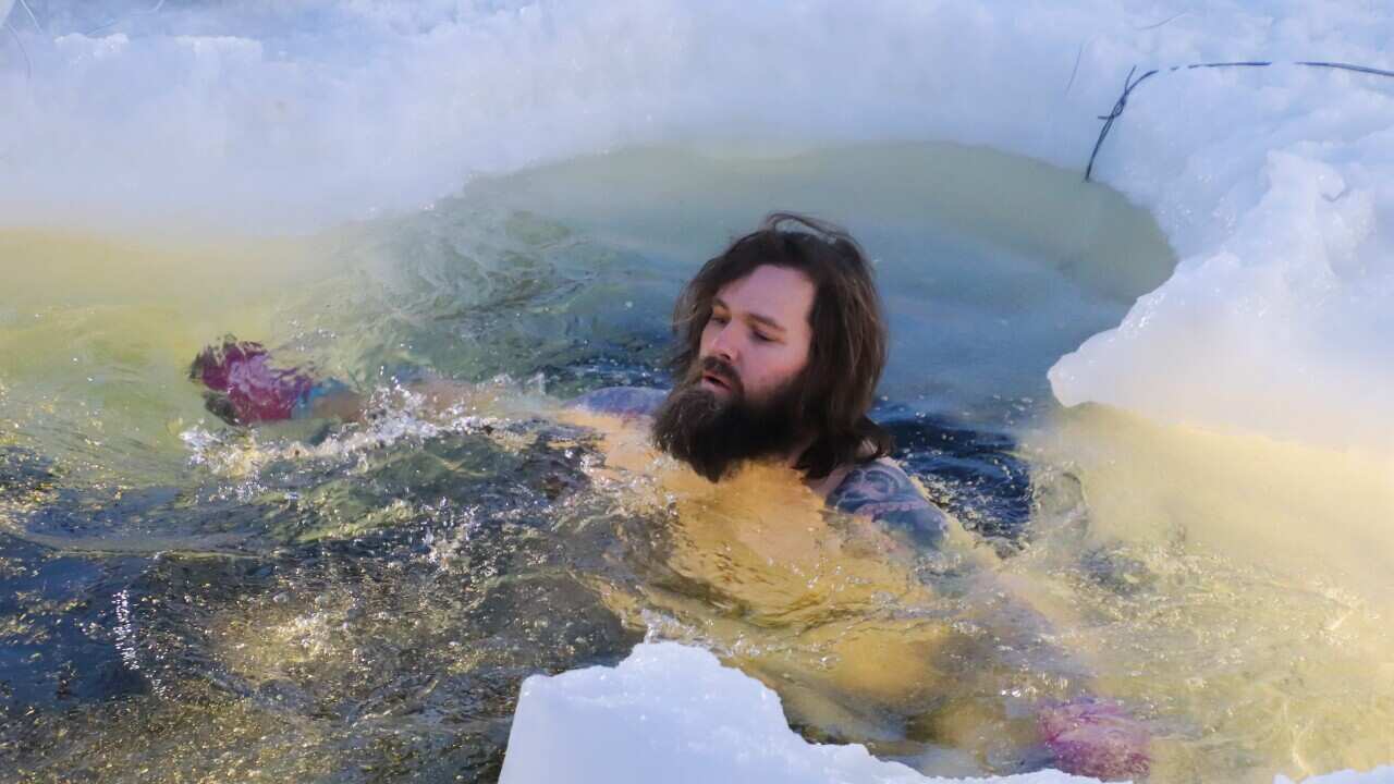 Antarctic expedition members celebrated the midwinter by taking a dip. 