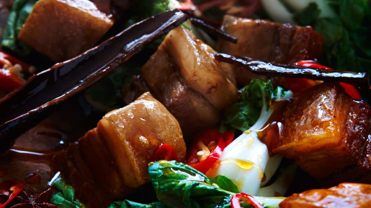 Crispy pork belly with palm sugar caramel sauce and steamed baby buk choy