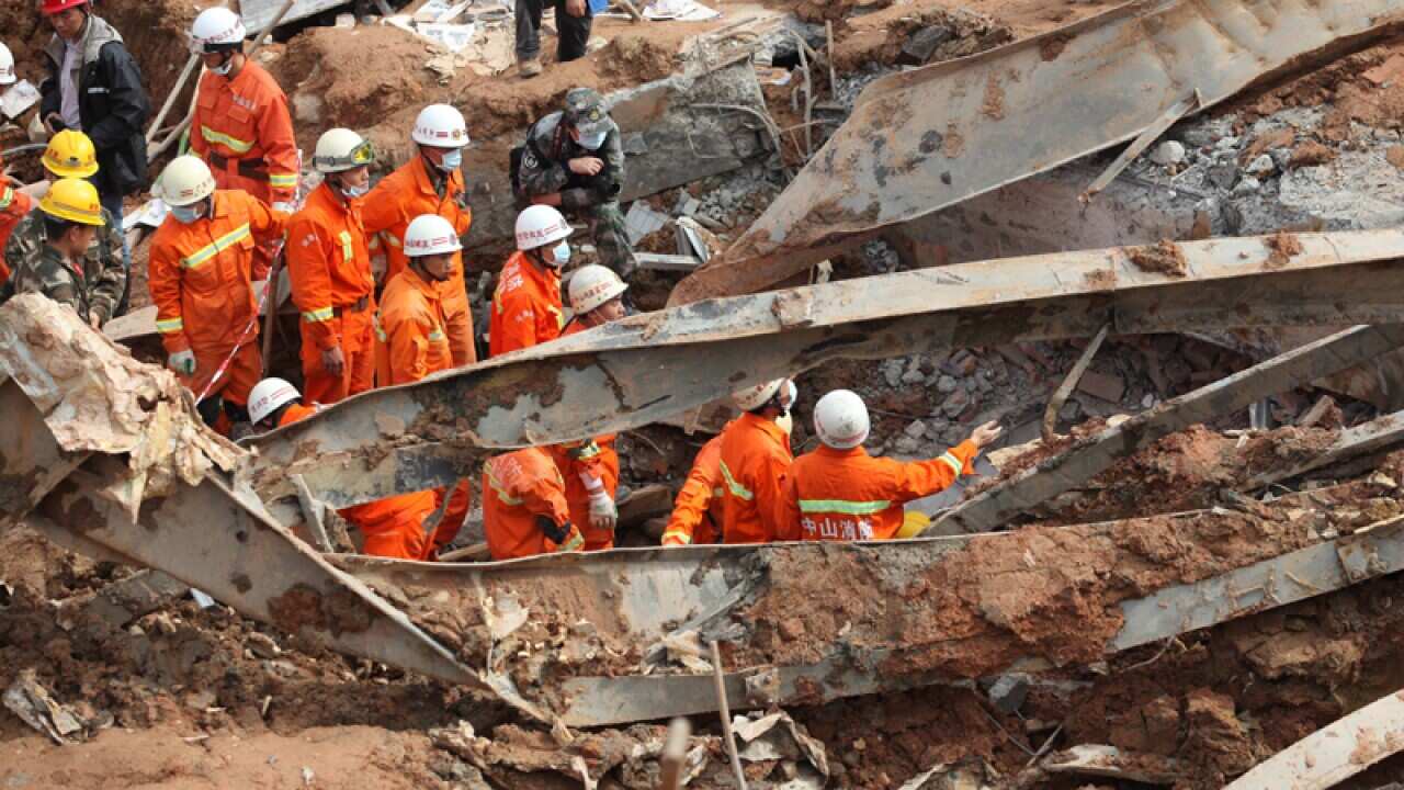 Rescuers search at the site of a landslide in Shenzhen city