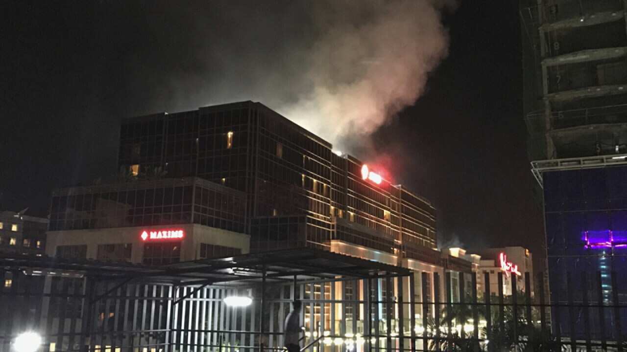 Smoke rises from the Resorts World Manila complex