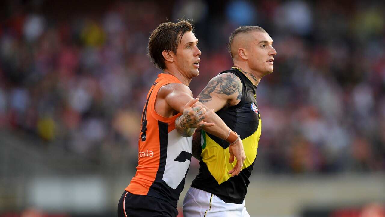 Matt de Boer of the Giants and Dustin Martin of the Tigers contest during the Round 3 AFL match between the GWS Giants and Richmond Tigers.