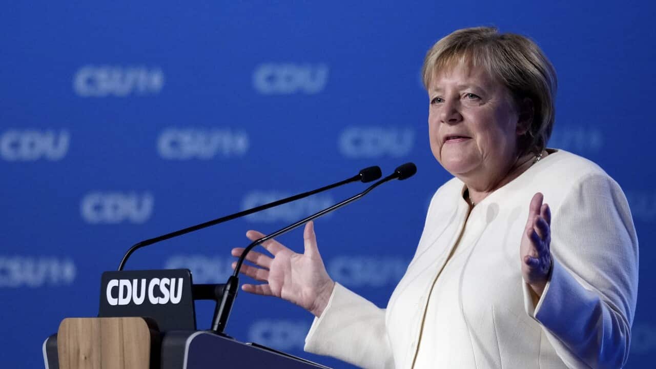 German chancellor Angela Merkel gestures during her speech at a state election campaign in Munich, Germany, Friday, Sept. 24, 2021 two days before the General election on Sunday, Sept. 26, 2021. (AP Photo/Matthias Schrader)