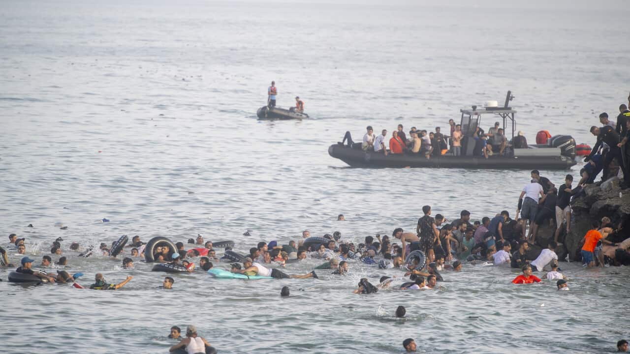 Hundreds of migrants reach Spain's Ceuta after swimming from Morocco