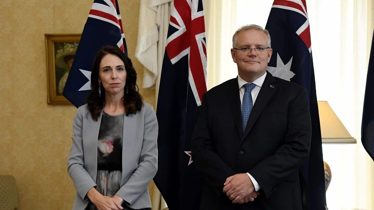 New Zealand Prime Minister Jacinda Ardern stands with Australian Prime Minister Scott Morrison in 2020.