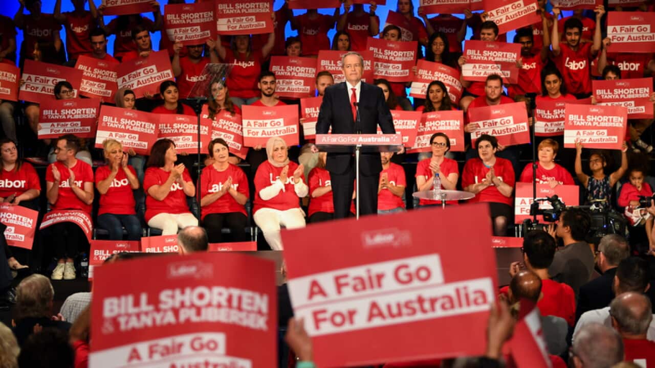 Labor party volunteers listen to Australian Opposition Leader Bill Shorten speak during a Labor volunteers rally at the Southern Cross Vocational College in Burwood in Sydney, Sunday, April 14, 2019. (AAP Image/Lukas Coch) NO ARCHIVING
