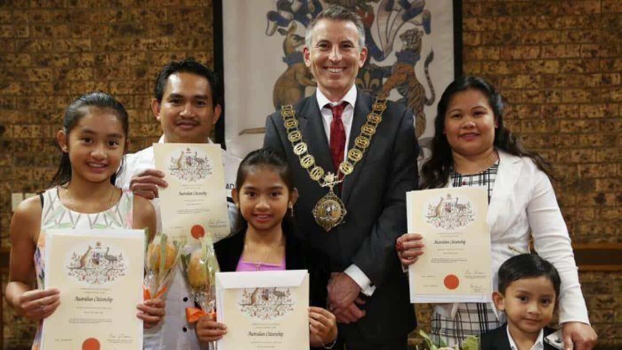 Mayor Ben Keneally and a family of new Australian citizens at the Botany Council citizenship ceremony