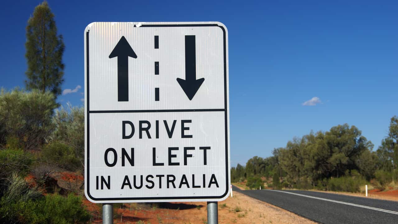 DRIVE ON LEFT IN AUSTRALIA sign beside Lasseter Highway, Northern Territory, Australia