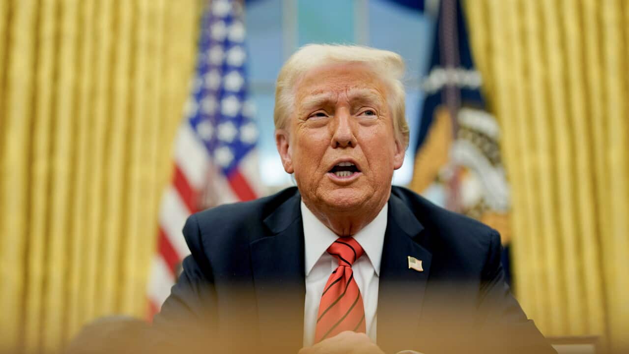 US President Trump signs executive order in Oval Office