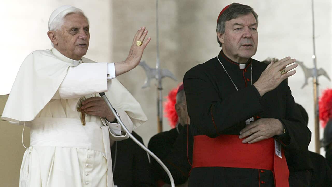 Pope Benedict XVI and Cardinal George Pell, of Australia, bless the faithful during the weekly general audience in St. Peter's square at the Vatican (File)