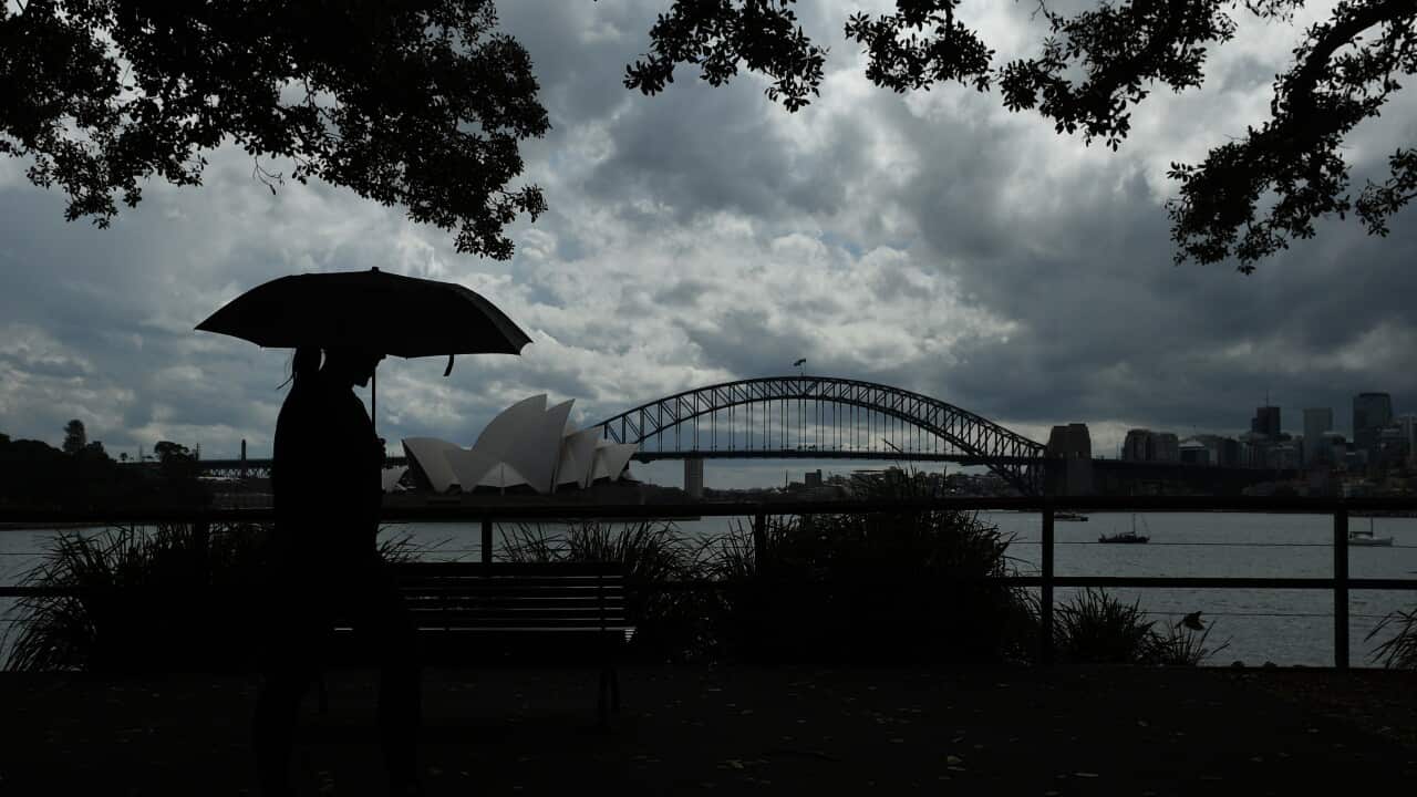 Stop clouds over the Sydney Harbour Bridge and Opera House in Sydney