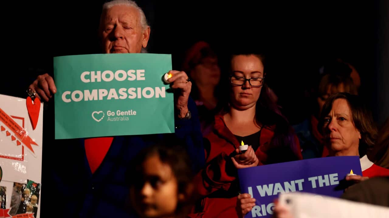 Supporters of a Voluntary Assisted Dying bill are seen during a candle light rally on the steps of Parliament House, Adelaide, Wednesday, May 26, 2021. (AAP Image/Kelly Barnes) NO ARCHIVING,