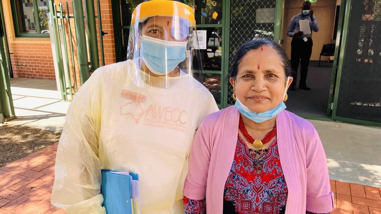 AWECC community worker Bhakti Mainali Dhamala with Bhutanese community member Ganga Khanal (SBS-Abby DInham)