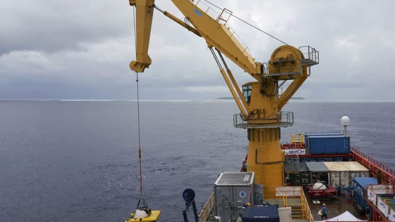 A submersible is lowered into the water during extensive tests